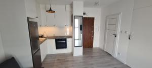 Kuchyňa alebo kuchynka v ubytovaní 61 - Apartamenty Siedlce - Nowy apartament w centrum przy ul 3 Maja 51a