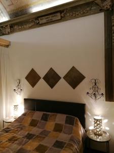 Giường trong phòng chung tại Residenza alla Scala del Borgo