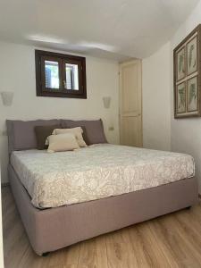 Кровать или кровати в номере Bellavista Rocce del Pevero