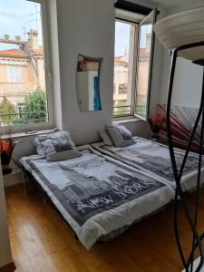 Ένα ή περισσότερα κρεβάτια σε δωμάτιο στο Center palais