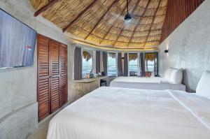 Postel nebo postele na pokoji v ubytování Maya Tulum By G Hotels