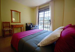 Ένα ή περισσότερα κρεβάτια σε δωμάτιο στο GALIHOST - Apartamentos Seixeliño en Playa Raeiros - Balea