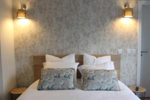 מיטה או מיטות בחדר ב-Casa Dona Alzira