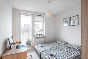 Posteľ alebo postele v izbe v ubytovaní Waw Mokotów pokoje Manhattan