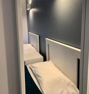 Postel nebo postele na pokoji v ubytování Aix Hotel