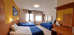 Postel nebo postele na pokoji v ubytování Laguna B&B