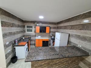 A kitchen or kitchenette at Alex sea view apartment - families only
