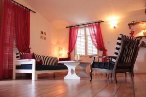 a living room with a couch and a table at Ge-Ni Mala Duba 86 in Živogošće