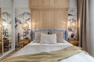 Łóżko lub łóżka w pokoju w obiekcie Modrzejewska Residence Zakopane