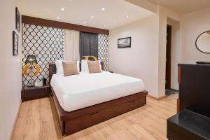 Ein Bett oder Betten in einem Zimmer der Unterkunft Golden Park Hotel Cairo, Heliopolis