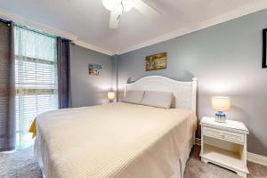a bedroom with a large white bed and a window at Sea Colony --- 909 Annapolis House in Bethany Beach +34 photos