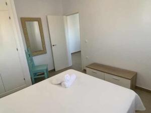 Łóżko lub łóżka w pokoju w obiekcie Apartamento 4 Atlantico
