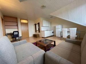 Posezení v ubytování Kegljišče VISOLE Apartmaji in Sobe