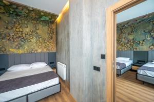 Postel nebo postele na pokoji v ubytování Continental Airport Hotel