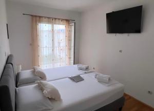 Postel nebo postele na pokoji v ubytování Apartments Mihi