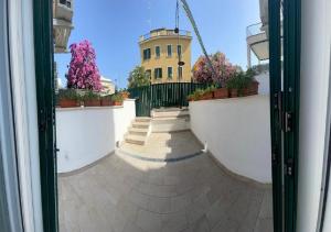 a view from a window of a building with flowers at Riviera Albachiara Anzio B&B in Anzio