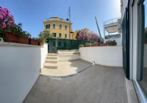 an empty courtyard with a building in the background at Riviera Albachiara Anzio B&B in Anzio