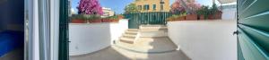 a group of stairs with potted plants on them at Riviera Albachiara Anzio B&B in Anzio