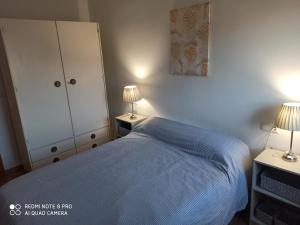 Łóżko lub łóżka w pokoju w obiekcie Amura Motril. Apartamento con garaje