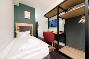 Ein Bett oder Betten in einem Zimmer der Unterkunft AMC Hotel - Schöneberg