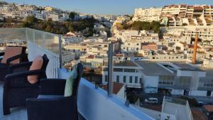 a view of a city from a balcony at Casa Alzira By ALzira in Albufeira