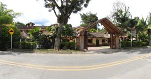 a building on the corner of a street with a road at Hotel Andino in San Agustín