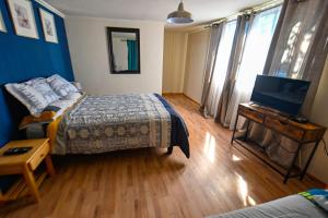A bed or beds in a room at Gecko Hostel