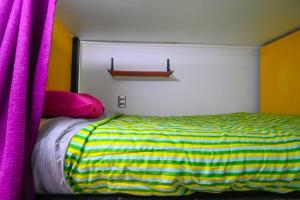 A bed or beds in a room at Gecko Hostel