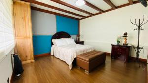 Postel nebo postele na pokoji v ubytování Departamentos Casa Río