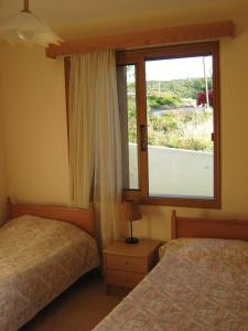 Кровать или кровати в номере Villa Pergia Latchi