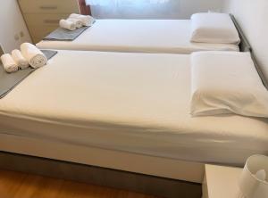 Postel nebo postele na pokoji v ubytování Apartments Mihi