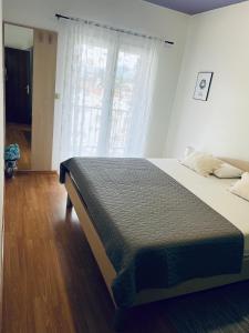 Postel nebo postele na pokoji v ubytování Apartments Mihi