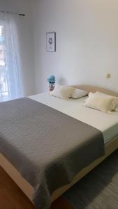 Postel nebo postele na pokoji v ubytování Apartments Mihi