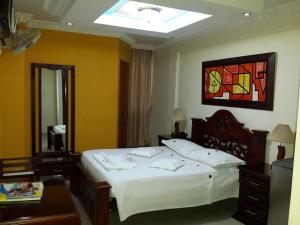 Кровать или кровати в номере Hotel Vans Valledupar