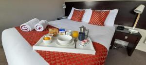 Voodi või voodid majutusasutuse Dunedin Palms Motel toas