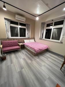 Postel nebo postele na pokoji v ubytování Nantou Xitou Riverside Homestay B&B
