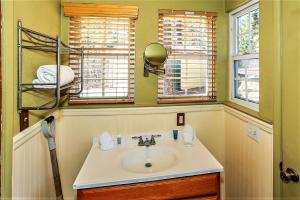 a bathroom with a sink and two windows at Frank's Old Bear-149 by Big Bear Vacations in Big Bear Lake +13 photos