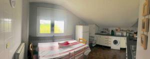 a small kitchen with a bed in a room at Only 30 Kms From San Sebastian in Bera