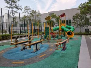 a playground in front of a building at G-mat Staycation free WiFi & Netflix in Cyberjaya