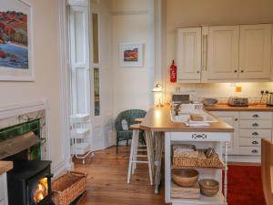 a kitchen with a counter and a stove at Rydal Suite in Ambleside