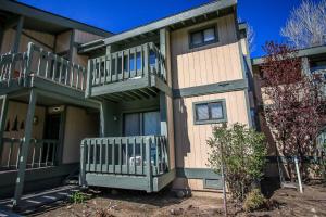 a apartment building with a balcony and a porch at Boulder Creek -1417 by Big Bear Vacations in Big Bear Lake
