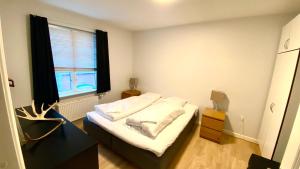 Ένα ή περισσότερα κρεβάτια σε δωμάτιο στο Sønderborg City Apartments
