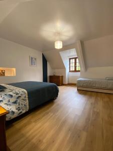 Ein Bett oder Betten in einem Zimmer der Unterkunft Un havre de paix