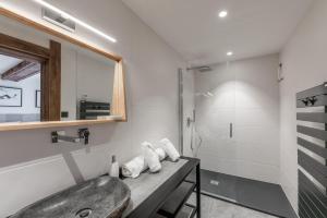 a bathroom with a sink and a shower at Chalet Izoard in Saint-Chaffrey