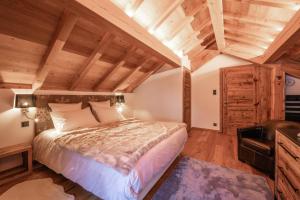 Postel nebo postele na pokoji v ubytování Chalet Izoard