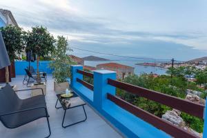 a balcony with a view of the water at Althea Apartments 1 in Halki