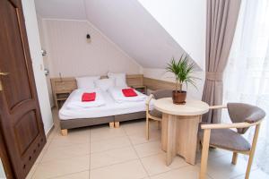 Postel nebo postele na pokoji v ubytování Paula Wellness & SPA