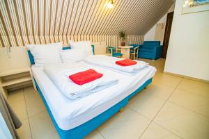 Postel nebo postele na pokoji v ubytování Paula Wellness & SPA
