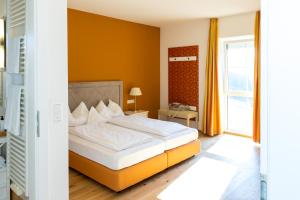 Postel nebo postele na pokoji v ubytování Landhotel GUT MOSER