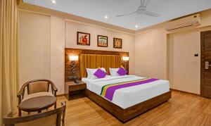 Letto o letti in una camera di Treebo Premium Median Inn